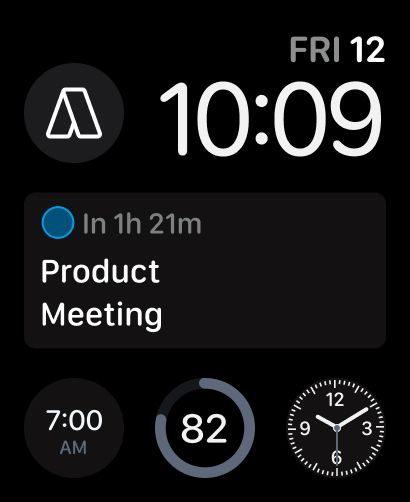 A watch face with the Akiflow circular complication showing the Akiflow logo and the rectangular complication counting down to Product Meeting in 1h 21m.